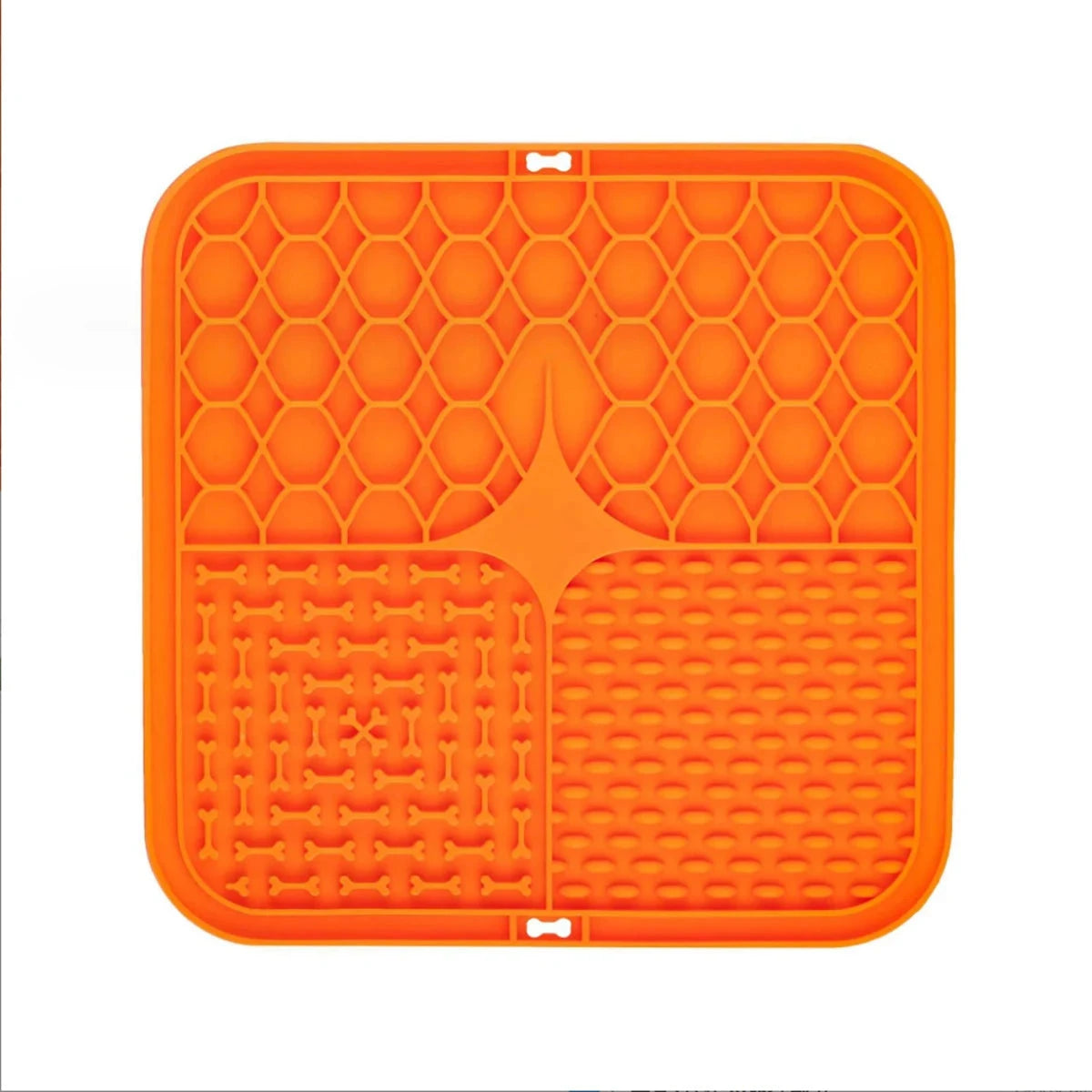 Orange silicone mat with textured surface on a white background