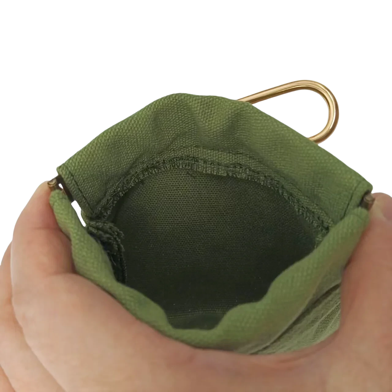 Green fabric pouch held by a hand with a gold clip on a white background