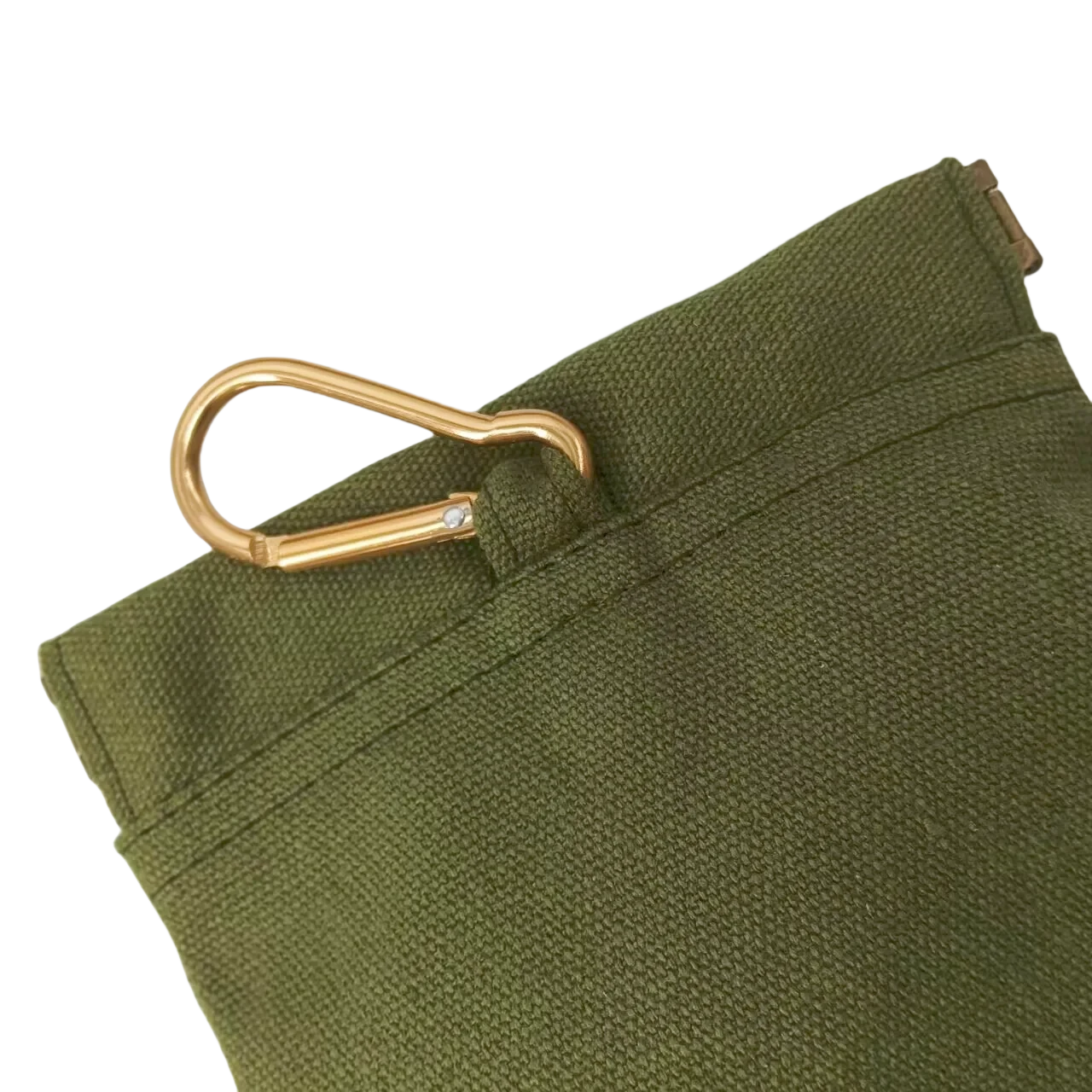 Green fabric with a gold metal clip on a white background