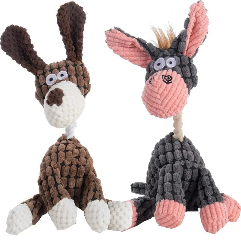Two knitted donkey toys, one brown and white, the other gray and pink, on a white background.