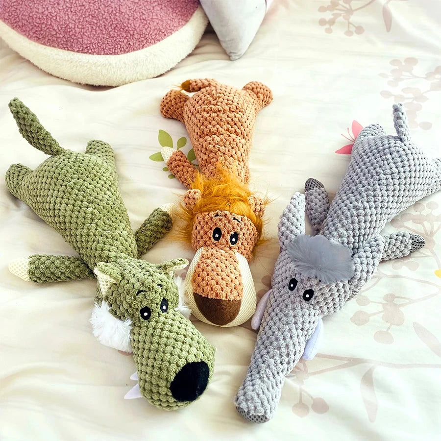 Three crocheted animal toys on a soft surface