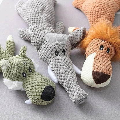 Three crocheted animal toys on a gray surface