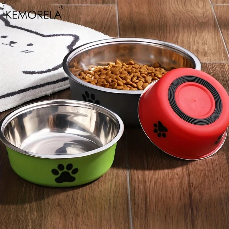 Three pet bowls with food on a wooden floor, featuring KEMORELA branding.